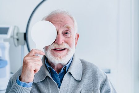 Happy,Aged,Grandfather,Checking,Up,Vision,Closing,His,Eye