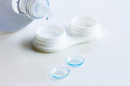 Contact,Lenses,,Case,And,Bottle,With,Solution,On,White,Background.