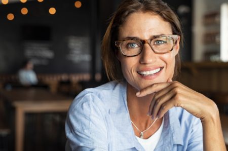Portrait,Of,Happy,Mature,Woman,Wearing,Eyeglasses,And,Looking,At